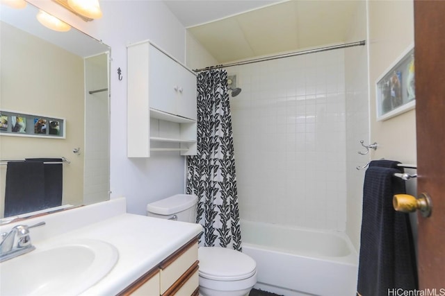 full bath with vanity, toilet, and shower / tub combo with curtain