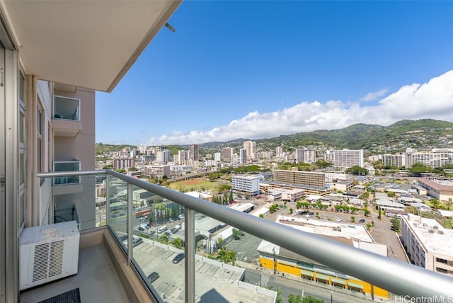 balcony with a city view and a mountain view