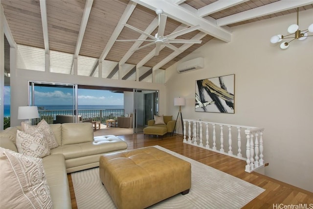 living area featuring beamed ceiling, a water view, wood finished floors, a wall unit AC, and wood ceiling