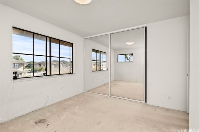 unfurnished bedroom with a closet