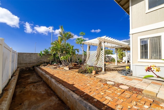 view of patio / terrace with a pergola and a fenced backyard