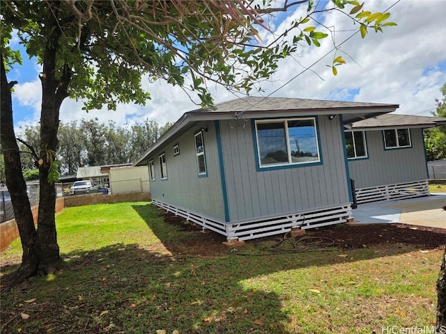 view of home's exterior featuring a yard