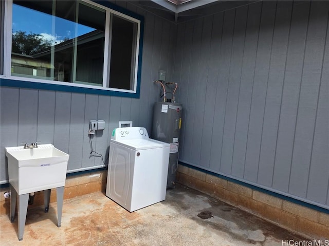 laundry area featuring washer / clothes dryer and electric water heater