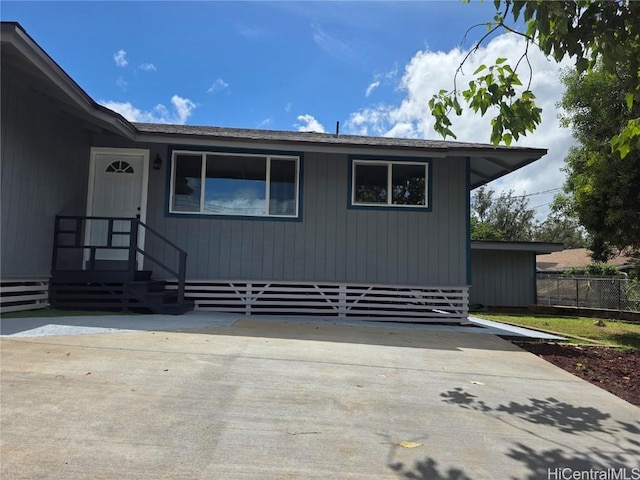 view of front of property featuring fence