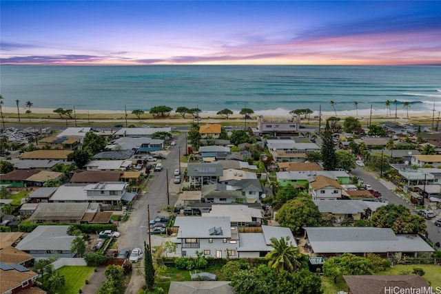 aerial view featuring a water view, a residential view, and a view of the beach