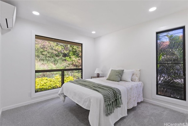 carpeted bedroom with baseboards and recessed lighting