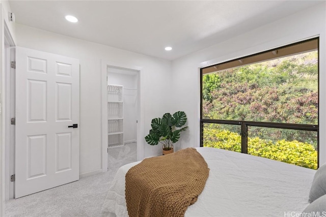 bedroom featuring recessed lighting and light colored carpet