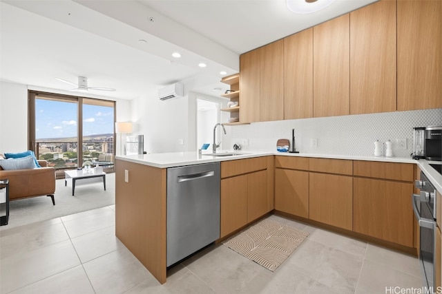 kitchen with a sink, open floor plan, an AC wall unit, backsplash, and dishwasher