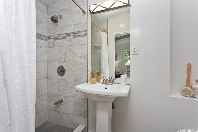 bathroom with a tile shower