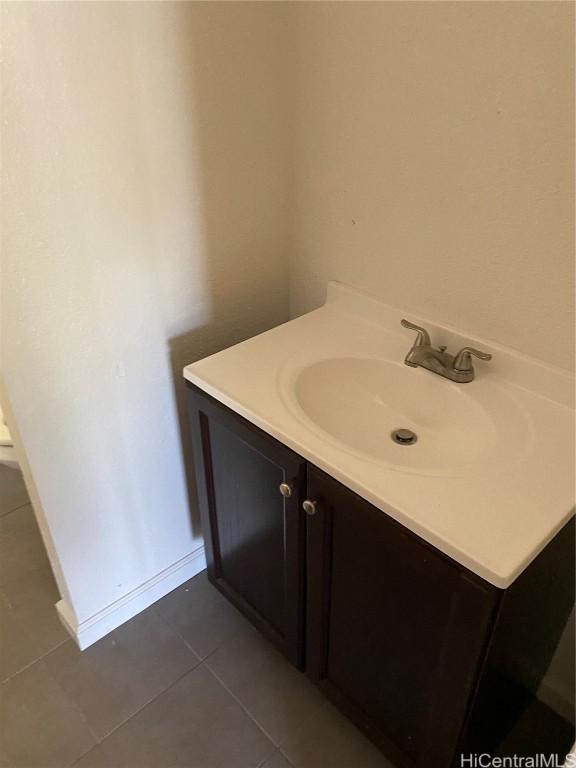 bathroom featuring tile patterned flooring and vanity