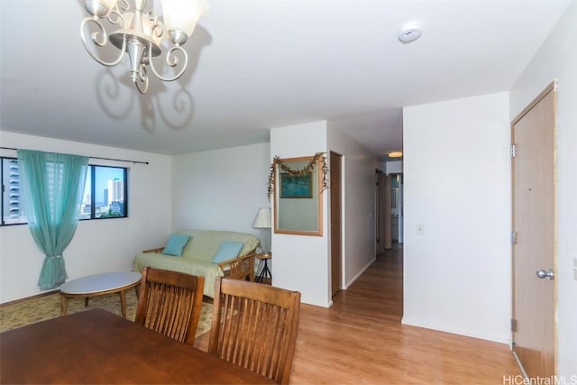 interior space with a notable chandelier and light wood finished floors