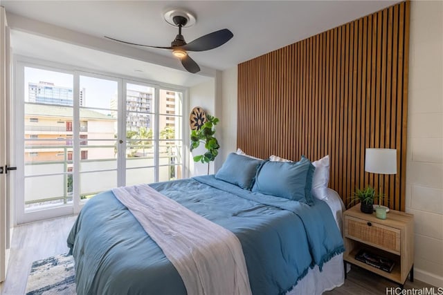 bedroom featuring a ceiling fan and wood finished floors