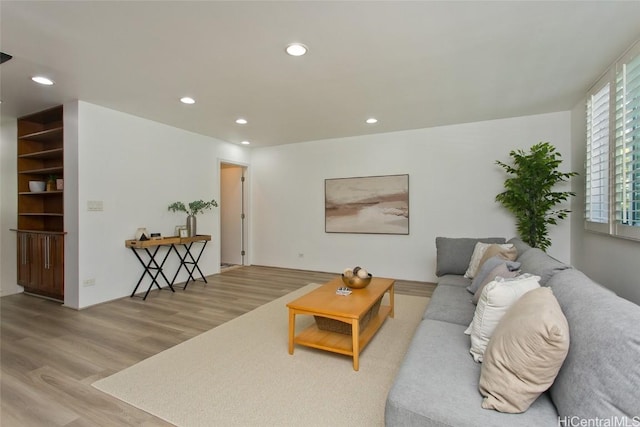 living room featuring recessed lighting and wood finished floors