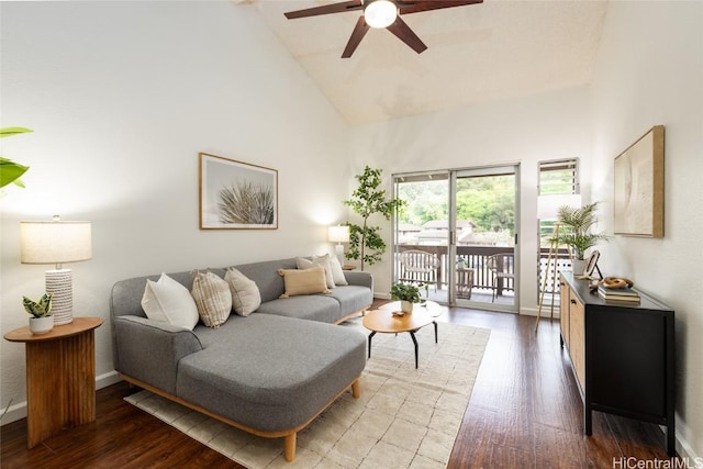 living room featuring baseboards, high vaulted ceiling, a ceiling fan, and wood finished floors