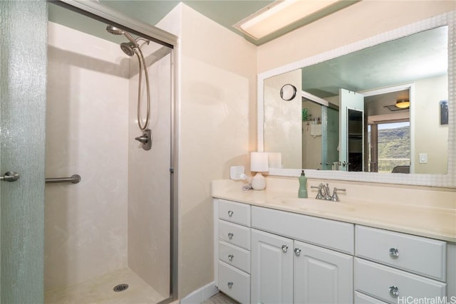 full bathroom featuring a stall shower and vanity