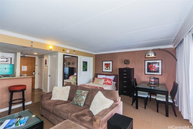 living area featuring crown molding