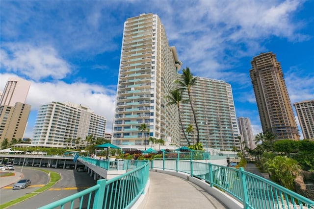 view of property featuring a view of city and fence