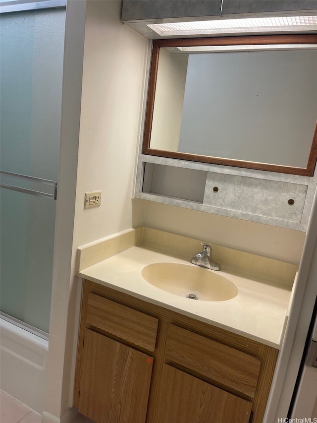 825 Coolidge St Unit 311, Honolulu, HI 96826 - bathroom featuring vanity and shower / bath combination with glass door
