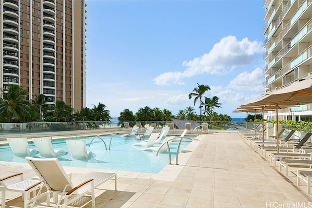 pool featuring a patio and fence