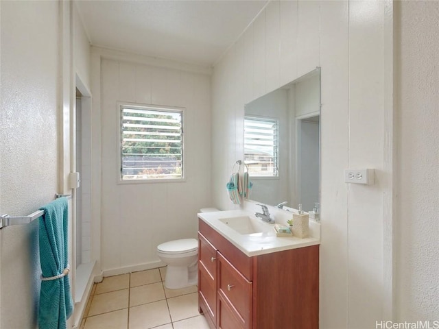 full bath featuring a shower, toilet, vanity, baseboards, and tile patterned floors