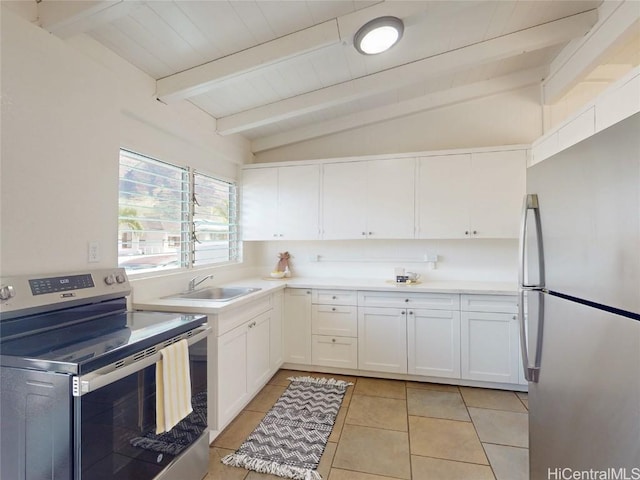 kitchen featuring vaulted ceiling with beams, a sink, white cabinets, light countertops, and appliances with stainless steel finishes