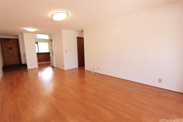 unfurnished room featuring wood finished floors