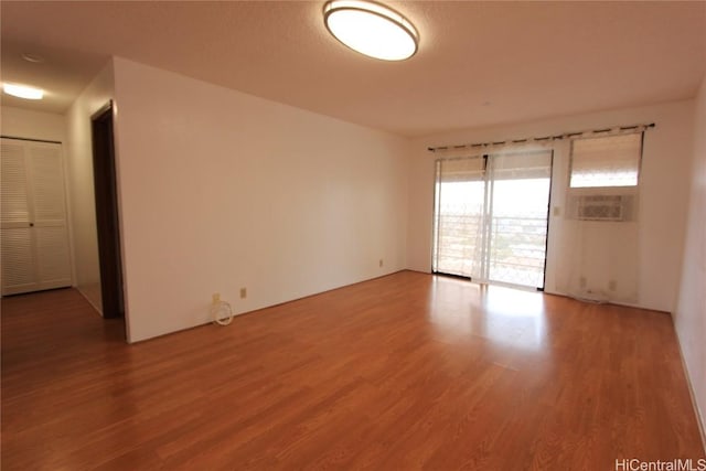 spare room with light wood finished floors