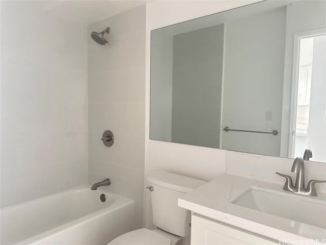 full bathroom featuring washtub / shower combination, vanity, and toilet