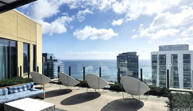 view of patio / terrace with a view of city and a balcony