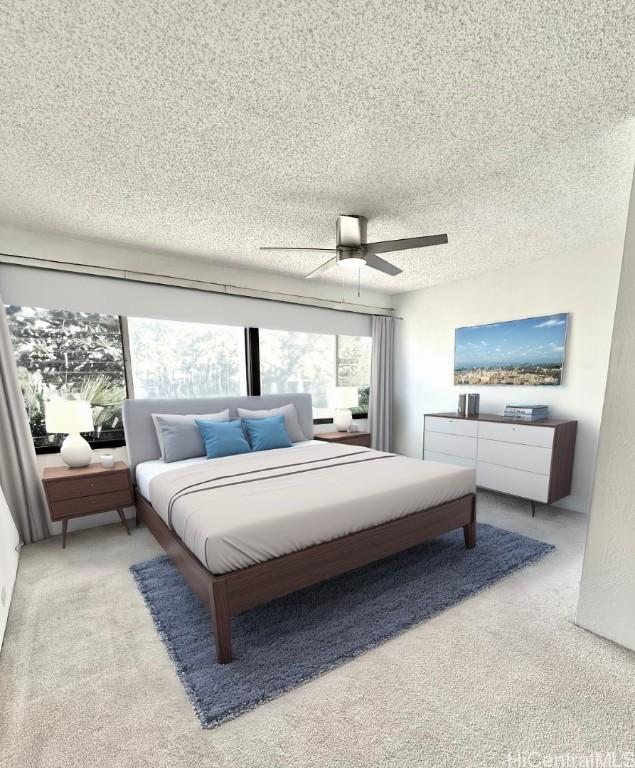 bedroom featuring a ceiling fan, light colored carpet, and a textured ceiling