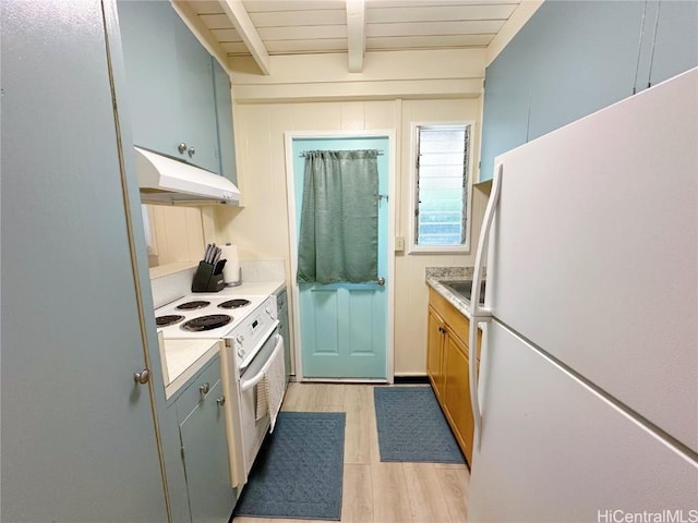 kitchen with beam ceiling, light countertops, light wood-type flooring, white appliances, and under cabinet range hood