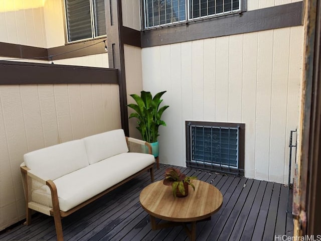 wooden deck with an outdoor living space