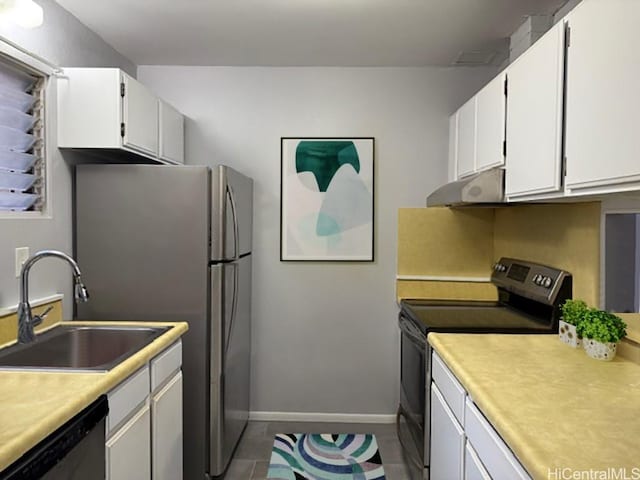 kitchen with black range with electric stovetop, under cabinet range hood, light countertops, dishwashing machine, and a sink