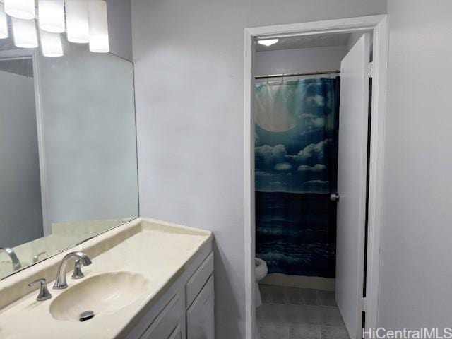 bathroom with tile patterned floors, toilet, vanity, and a shower with shower curtain