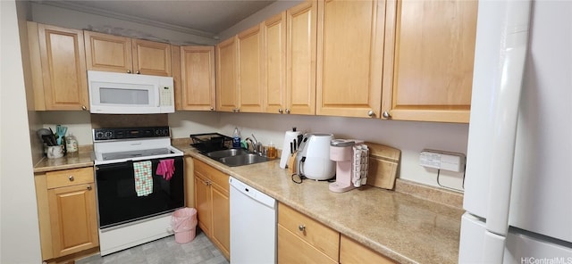 kitchen with white appliances, light brown cabinets, light countertops, and a sink