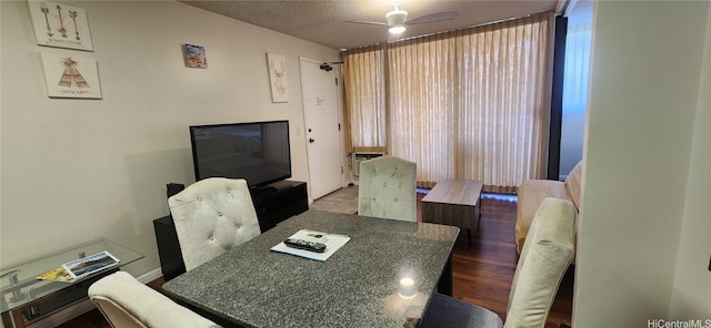 dining space featuring ceiling fan and wood finished floors