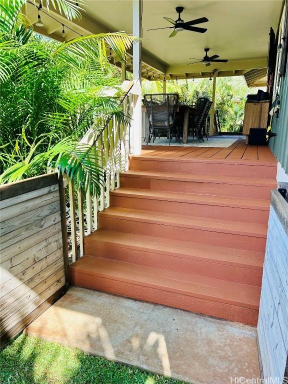 wooden terrace featuring ceiling fan