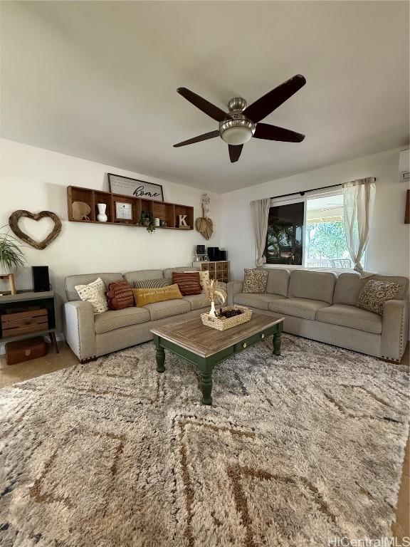 living room with a ceiling fan and a wall mounted AC