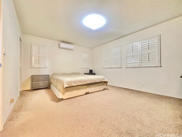 bedroom with carpet and a wall mounted air conditioner