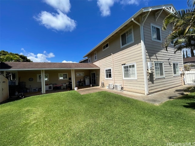 back of house featuring a yard, central AC, a patio area, and fence