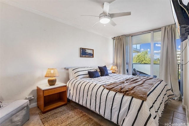 bedroom with baseboards, ceiling fan, expansive windows, and crown molding