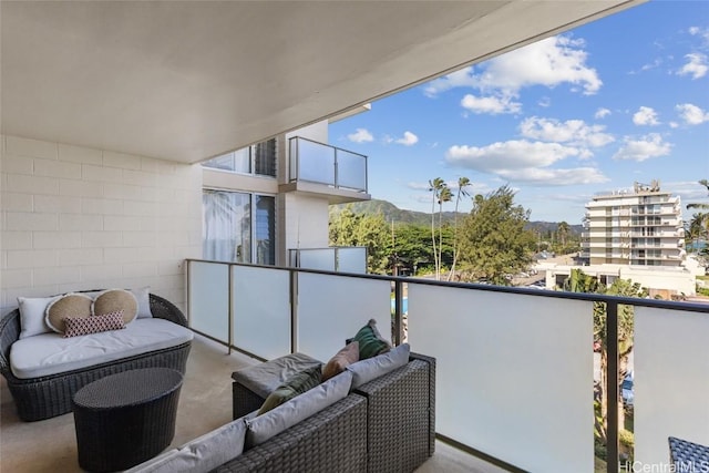 balcony featuring a mountain view