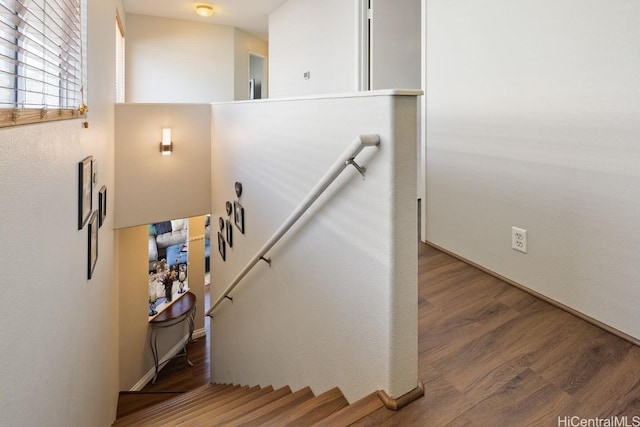 stairs with wood finished floors