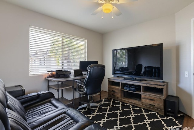 home office featuring wood finished floors and ceiling fan