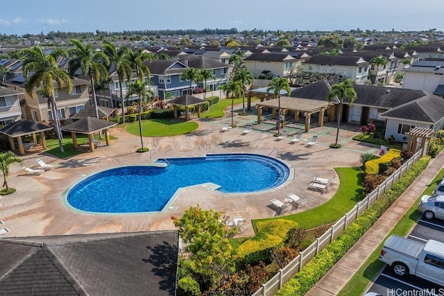 pool featuring a gazebo, a residential view, a patio area, and fence