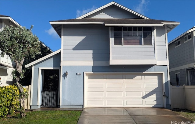 view of front facade with stucco siding, driveway, fence, a shingled roof, and a garage