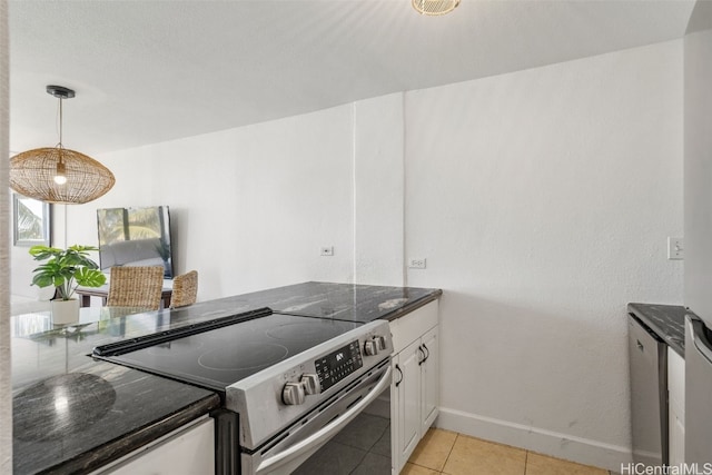 kitchen with pendant lighting, electric stove, light tile patterned floors, white cabinets, and a peninsula