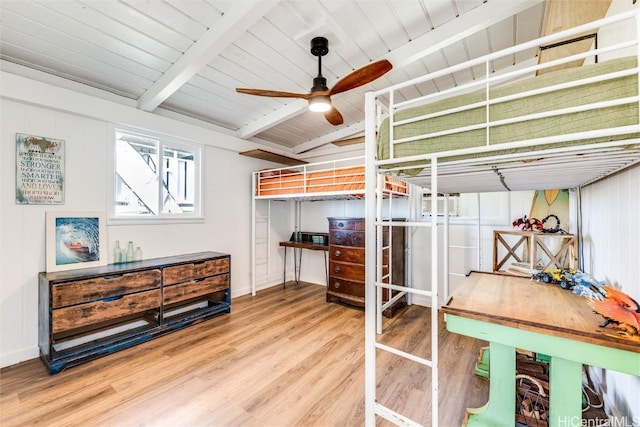 bedroom with wooden ceiling, lofted ceiling with beams, and wood finished floors