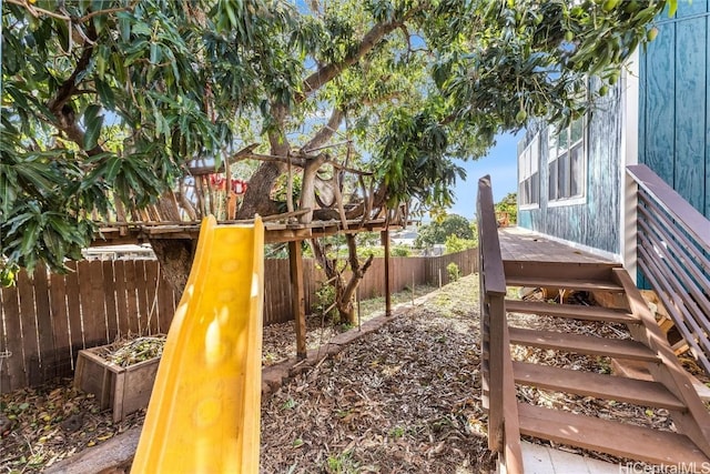 view of play area with a fenced backyard