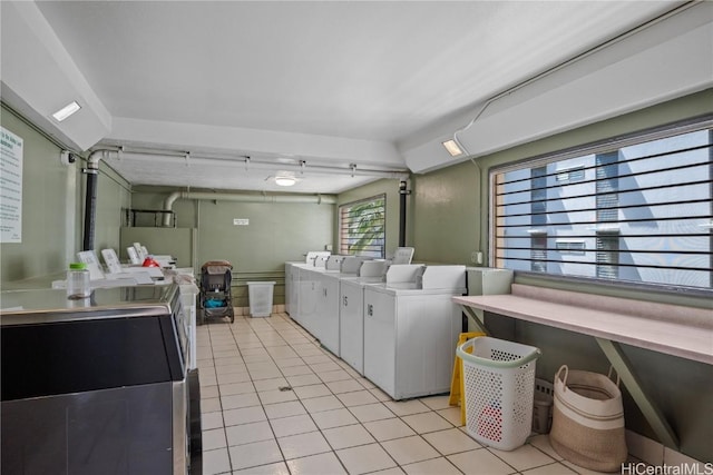 2211 Ala Wai Blvd Unit 2414, Honolulu, HI 96815 - shared laundry area with light tile patterned flooring and washer and dryer